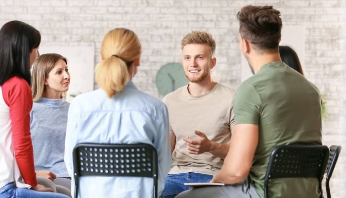 People undergoing IOP or PHP having a conversation during group therapy.