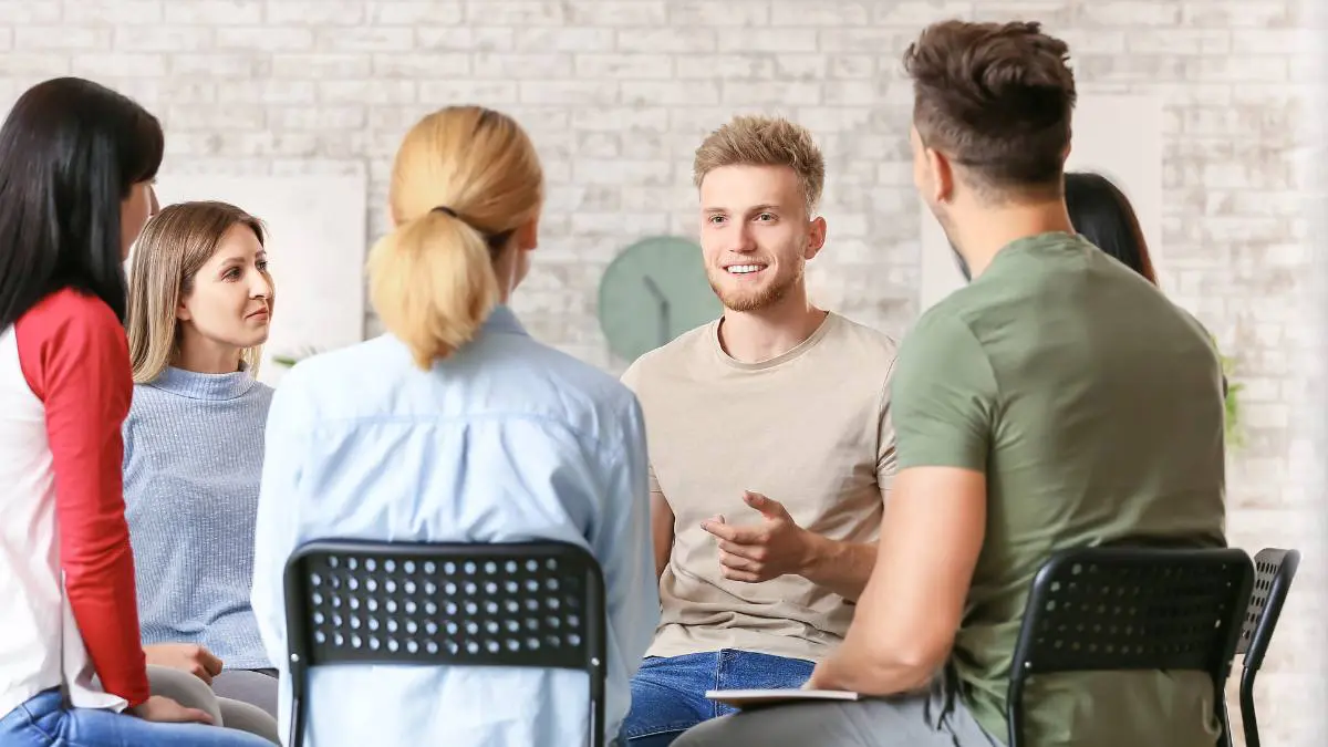 People undergoing IOP or PHP having a conversation during group therapy. 