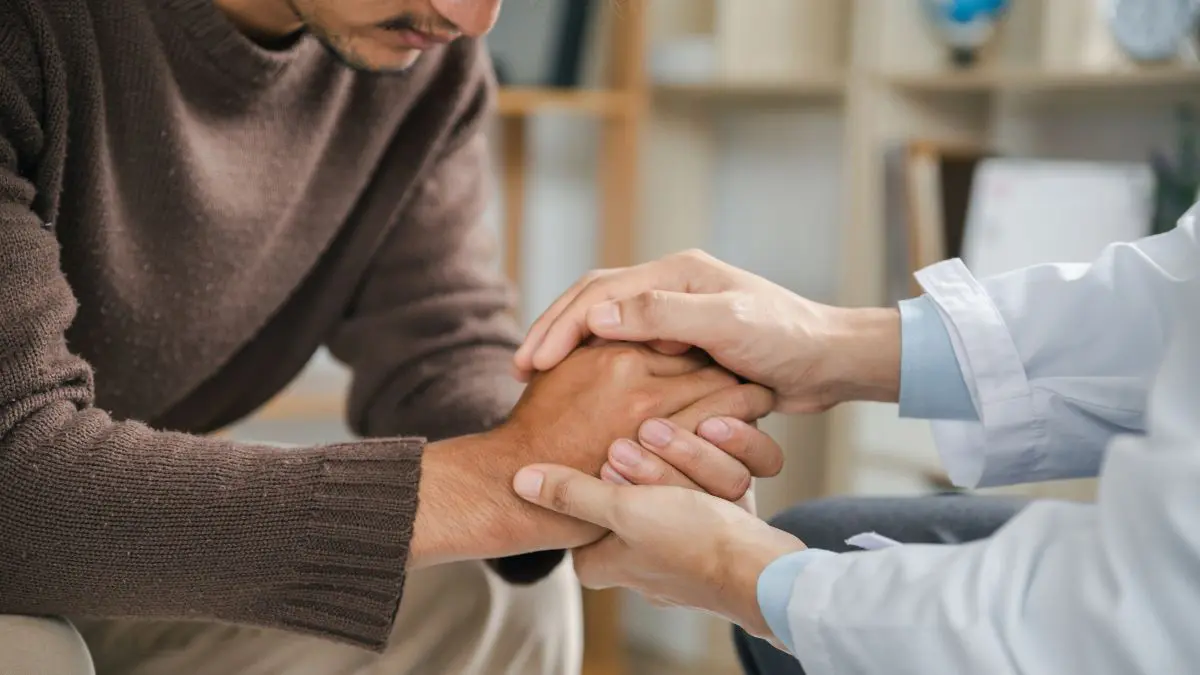 A therapist offering support to a patient dealing with substance abuse.
