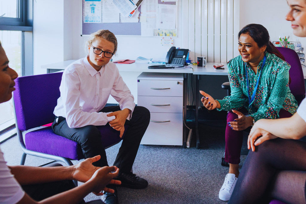A small group therapy session in a professional setting, highlighting St. Matthews Kentucky Drug and Alcohol Rehab Resources providing guidance for recovery.