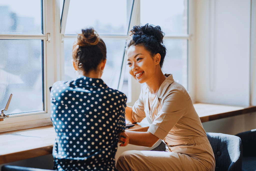 A one-on-one conversation between two women in a rehab setting, with one offering guidance and encouragement. This highlights the personalized care available through Berea Kentucky Drug and Alcohol Rehab Resources.