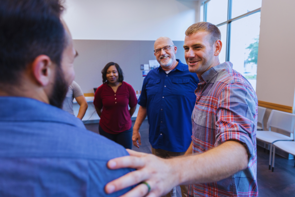 "A group of individuals engaged in conversation, offering mutual support during a rehab session. This represents the community and resources available through Shelbyville Kentucky Drug and Alcohol Rehab Resources, aimed at fostering recovery.