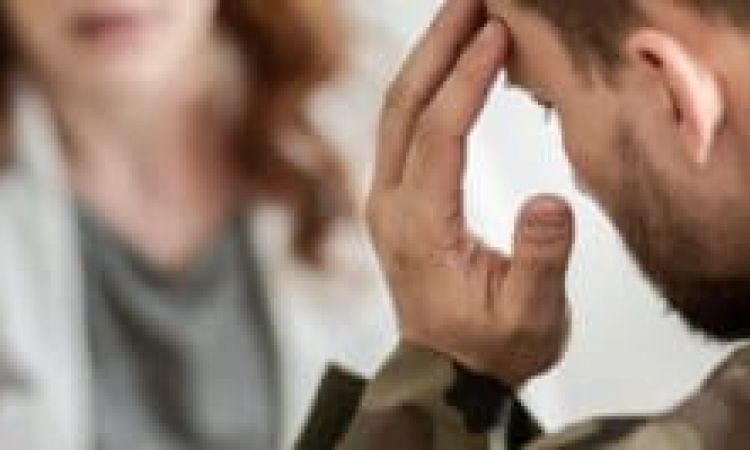 Man talking to therapist during rehab for veterans.